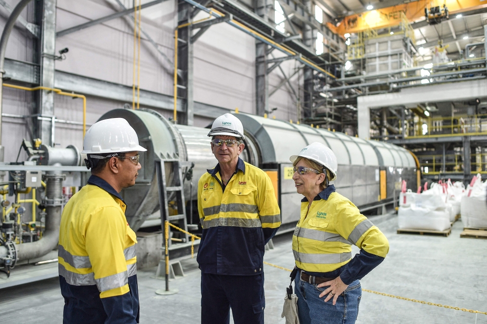 Lynas Malaysia chief operating officer Pol Le Roux (centre) and Lynas Malaysia chief executive officer Amanda Lacaze (right) speak at the Australian mining firm’s Malaysian rare earths refinery  in Gebeng, Pahang on April 8, 2026. — AFP pic