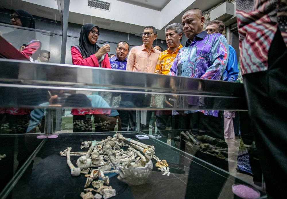 Perak Menteri Besar Datuk Seri Saarani Mohamad (5th left) views the ‘Perak Man’ skeleton at the reopening of the Lenggong Valley Archaeological Gallery in Lenggong, Perak, April 10, 2026. — Bernama pic