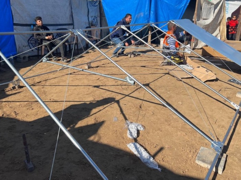 Aid workers assemble a fibreglass shelter frame at a displacement camp in Gaza. — Picture via Instagram/undpsweden