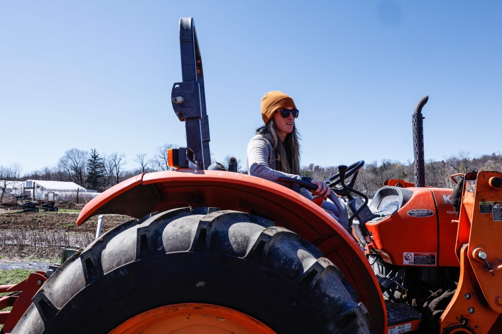 Sue Ferreri, executive director of Rockland Community Farm Network, drives a tractor at Cropsey Community Farm in New City, New York on April 8, 2026. — AFP pic