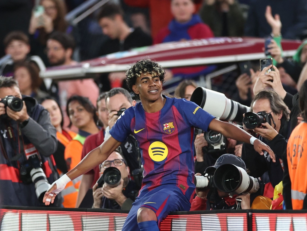 Barcelona’s Spanish forward #10 Lamine Yamal celebrates scoring his team’s third goal during the Spanish league football match between FC Barcelona and RCD Espanyol at the Camp Nou stadium in Barcelona on April 11, 2026. — AFP pic 