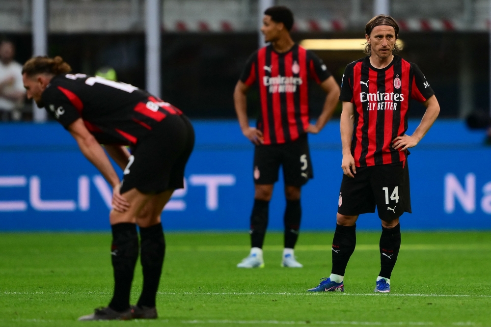 AC Milan Croatian midfielder #14 Luka Modri’s (right) reacts during the Italian Serie A football match between AC Milan and Udinese at the San Siro stadium in Milan April 11, 2026. — AFP pic 