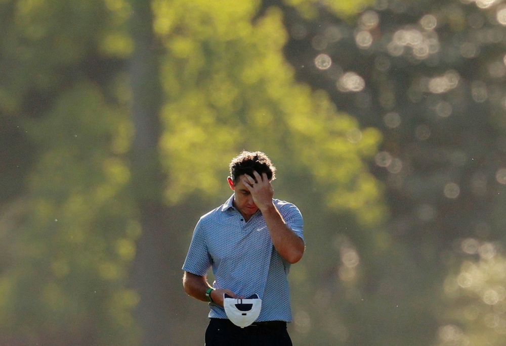 McIlroy falters, shares Masters lead with surging Young after wild third round