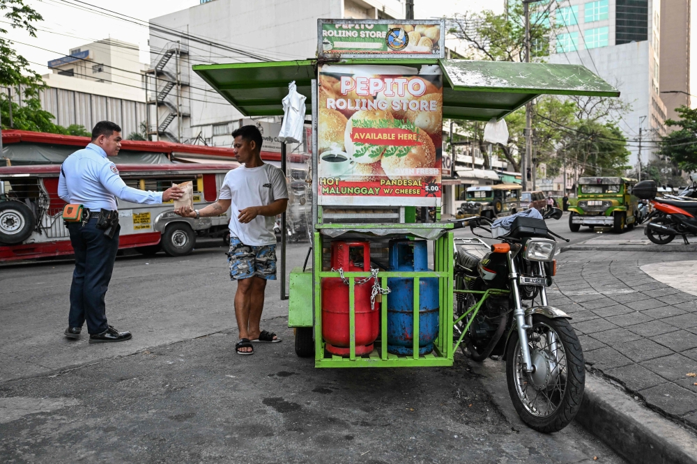 Filipinos feel pinch as LPG prices soar, hitting street food vendors after Middle East conflict