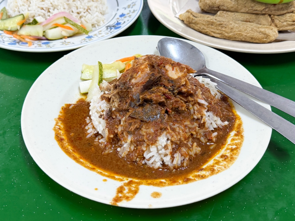 Nasi Dagang Ikan uses a chunk of ‘ikan tongkol hitam’ paired with a sweeter ‘gulai’ — Picture by Lee Khang Yi
