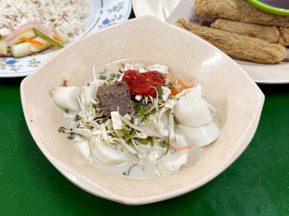 Laksam is prepared differently here, using a thick ‘belacan’ block for flavour when mixed together. — Picture by Lee Khang Yi