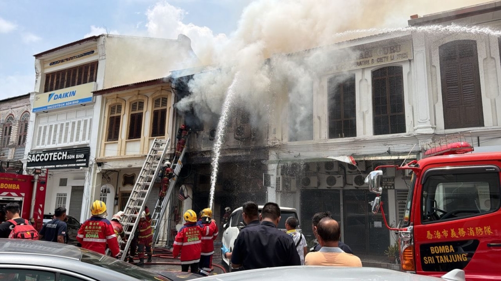 Fire engulfs Penang legal firm on King Street, two dead