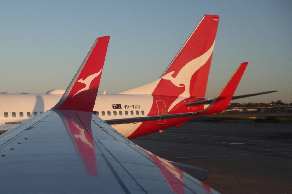 A Qantas logo is visible on the tail of an aeroplane at an airport in Sydney September 18, 2025. — Reuters pic  