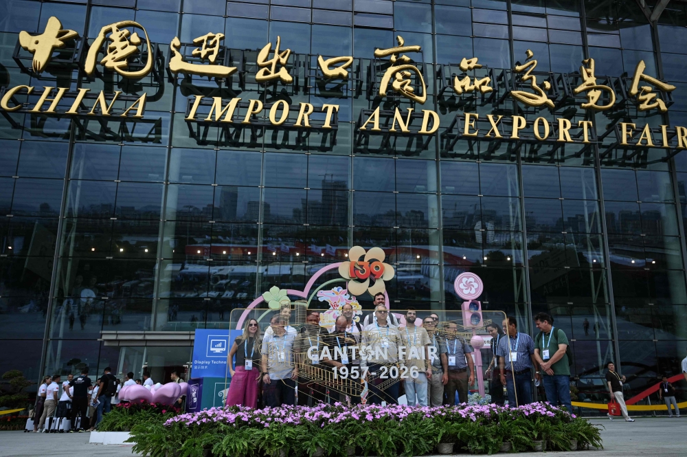 People pose for photos at the 139th session of China Import and Export Fair, also known as Canton Fair in Guangzhou, in southern China's Guangdong province on April 15, 2026. This year’s Canton Fair, which is held twice a year in the Chinese manufacturing hub of Guangdong province — is featuring a record 32,000 enterprises. — AFP pic