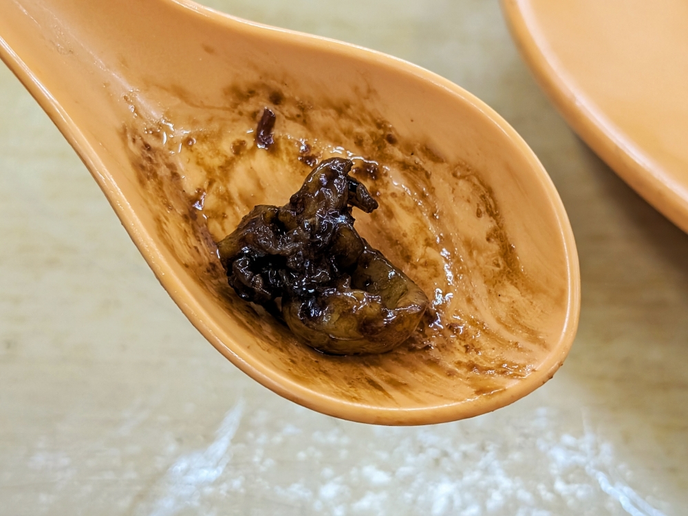 Baby squid is a unique inclusion in Peng Yuan’s Hokkien mee. — Picture by Ethan Lau