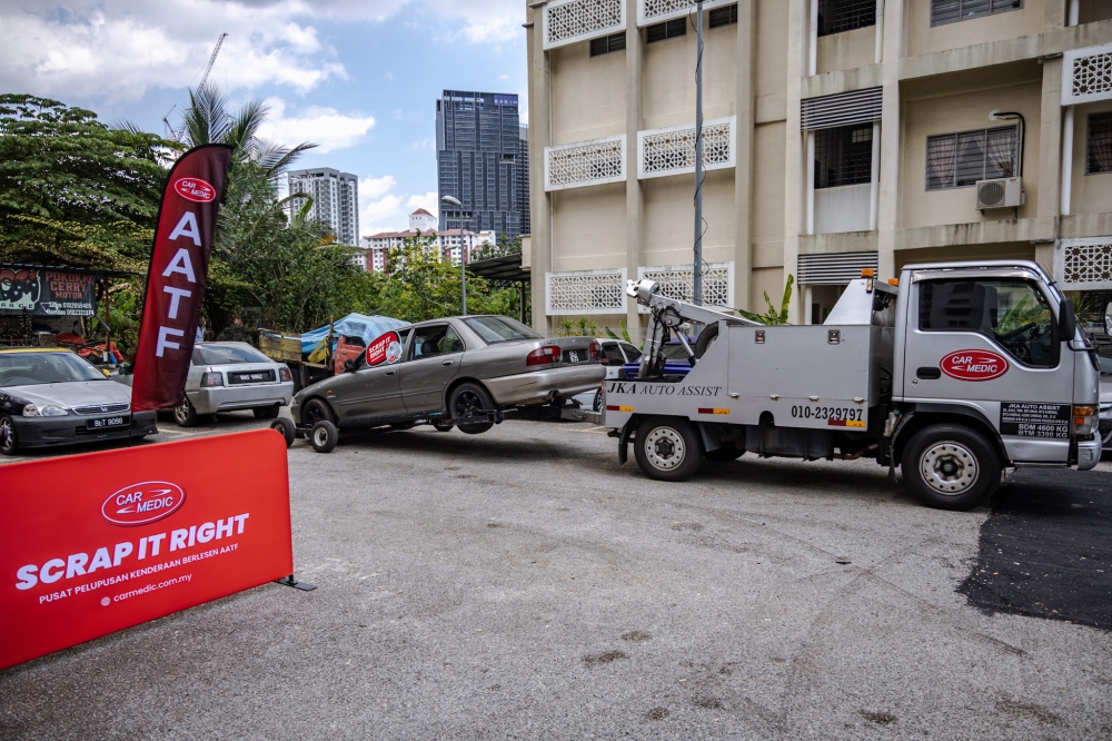 Abandoned vehicles are collected for voluntary disposal at Block D, PPR Pantai Ria, Kuala Lumpur on April 16, 2026. — Photo by Firdaus Latif