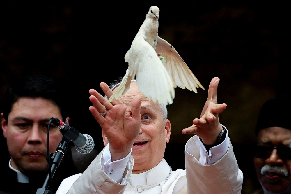 Pope Leo XIV releases a bird next to Archbishop of Bamenda Andrew Fuanya Nkea and other officials after a meeting for peace with the community of Bamenda in Saint Joseph’s Cathedral in Bamenda, Cameroon, April 16, 2026. — Reuters pic 