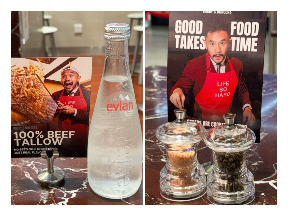 Evian water, rather than a generic brand, is served here (left). On the small tables, there are pink salt and pepper grinders (right). 
