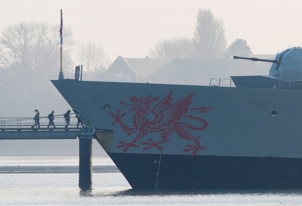 Crew members board the HMS Dragon during ammunitioning operations at the Upper Harbour Ammunitioning Facility in Portsmouth Harbour on March 4, 2026. — Reuters pic