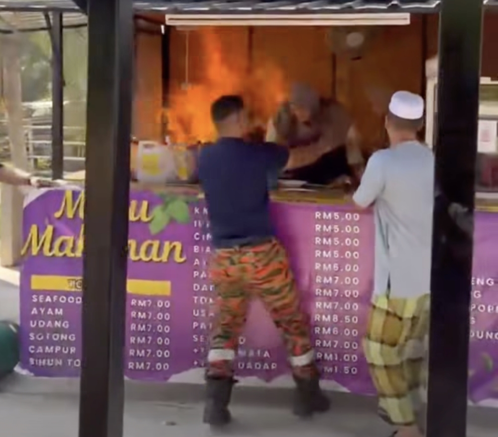 Food run turns rescue drama as off-duty firefighters save two from sudden blaze in Kedah (VIDEO)