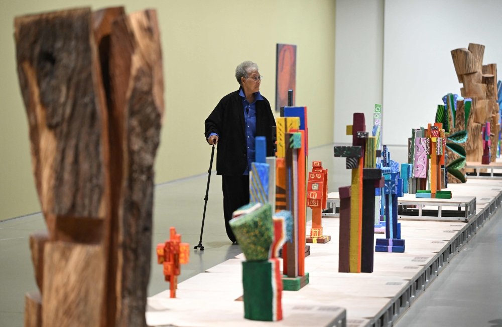 This picture taken on March 11, 2026, shows South Korean sculptor Kim Yun Shin looking at her works in her retrospective exhibition, titled ‘Two Be One’, at Hoam Museum of Art in Yongin. — AFP pic