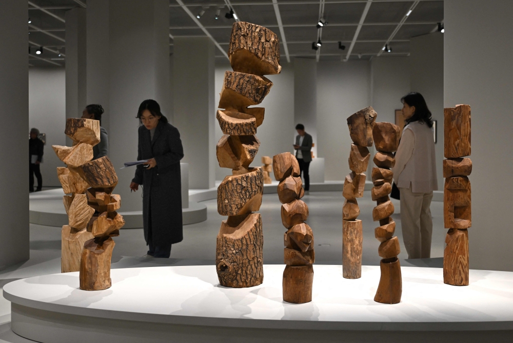 This picture taken on March 11, 2026, shows visitors looking at works of South Korean sculptor Kim Yun Shin in her retrospective exhibition, titled ‘Two Be One’, at Hoam Museum of Art in Yongin. — AFP pic