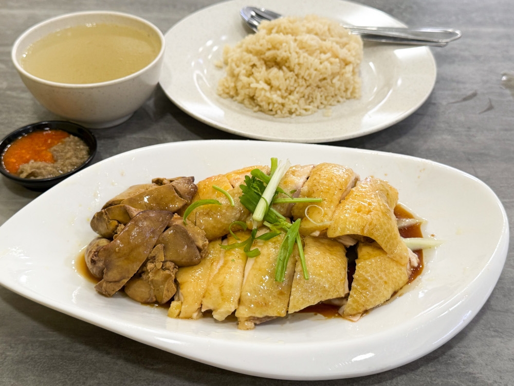 The lower quarter portion of the chicken pairs best with the fragrant oil rice. — Picture by Lee Khang Yi