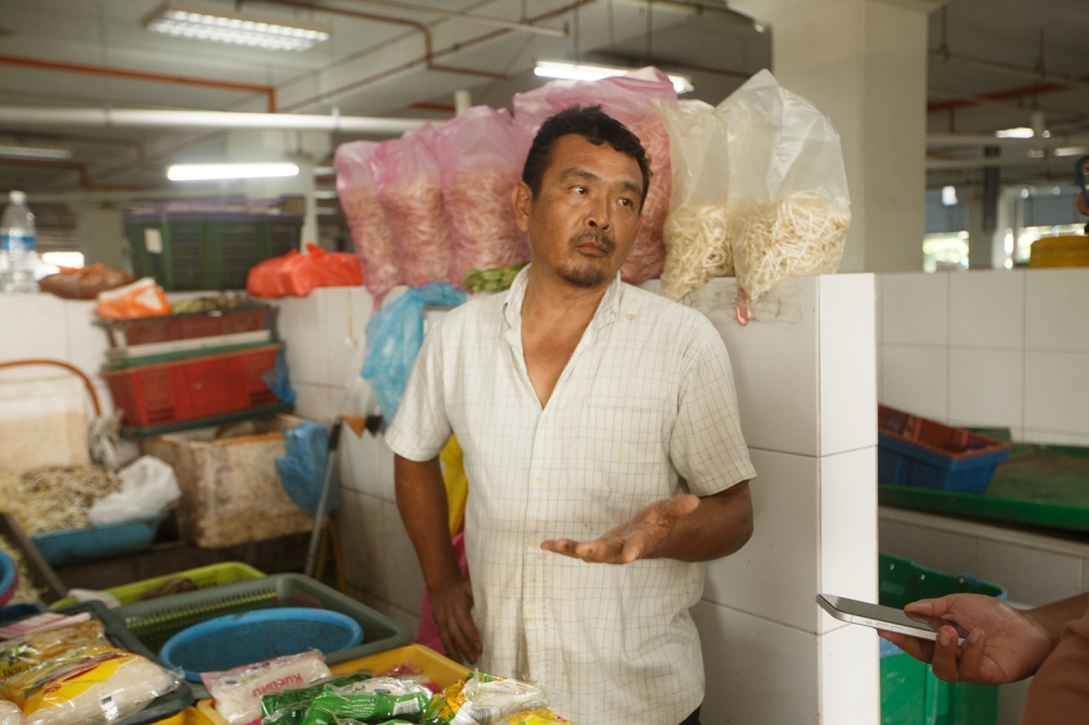 Vegetable vendor Kamol Cheng Thean speaks to the Malay Mail at Selayang Daily Market April 12, 2026. — Picture by Raymond Manuel