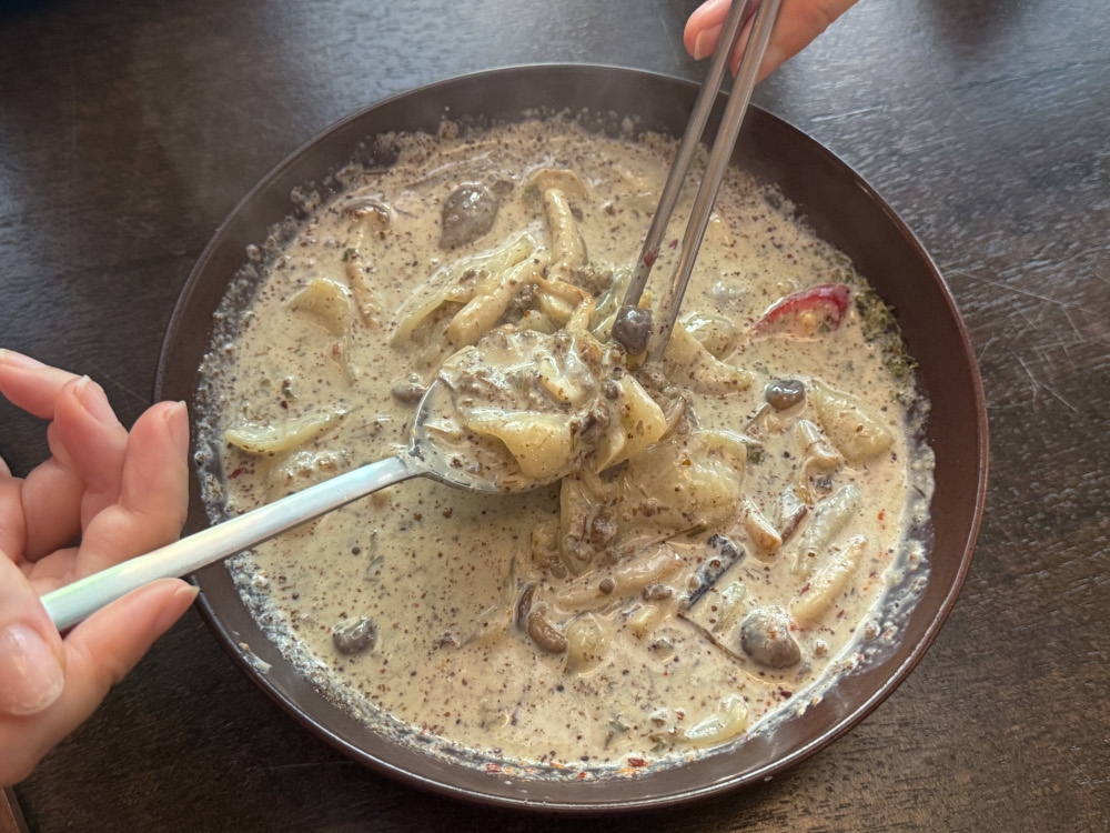 Once everything is mixed, you can spy the ‘sujebi’ with the fragrant creamy sauce dotted with perilla seeds. — Picture by Lee Khang Yi