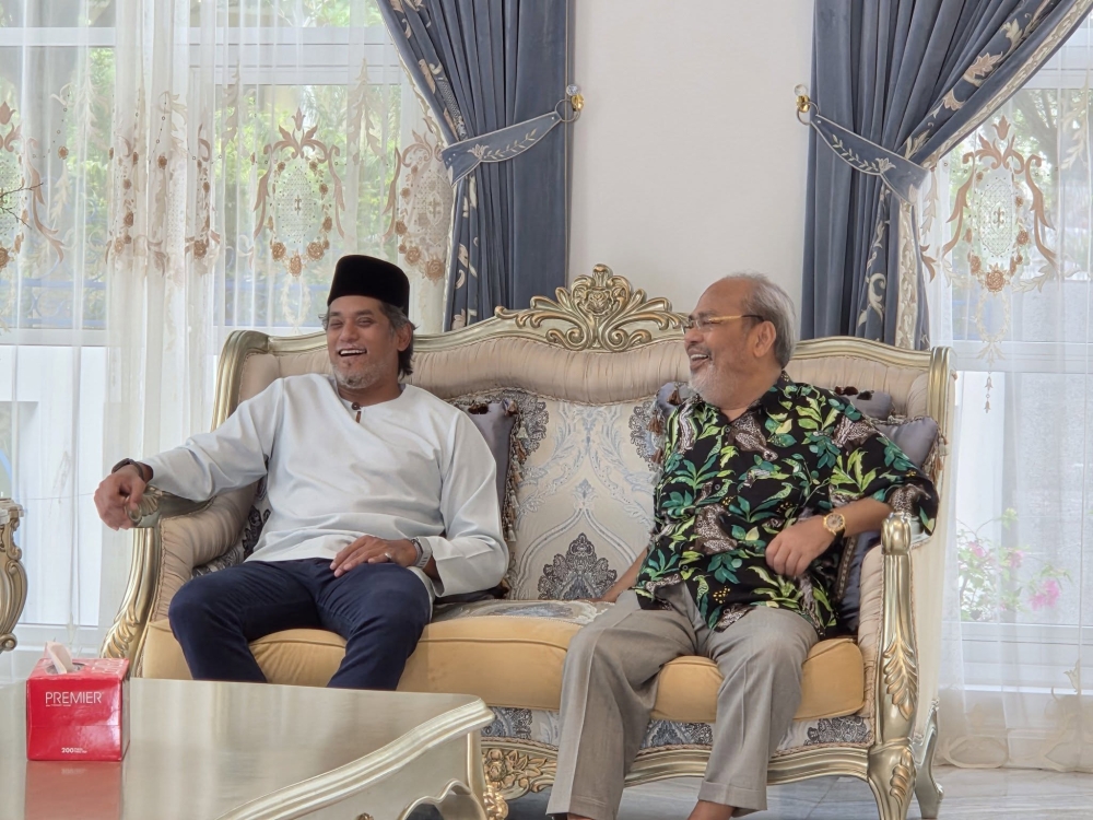 Khairy Jamaluddin (left) shares a moment with former Pasir Salak MP Datuk Seri Tajuddin Abdul Rahman on April 17, 2026. — Picture from Facebook/Dato Sri Tajuddin Rahman