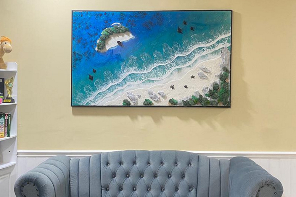 The young man from Kota Tinggi, Johor carefully produces each work through several layers to create the illusion of realistic waves, complete with sand and stone elements as if it were a real beach atmosphere. — Bernama pic