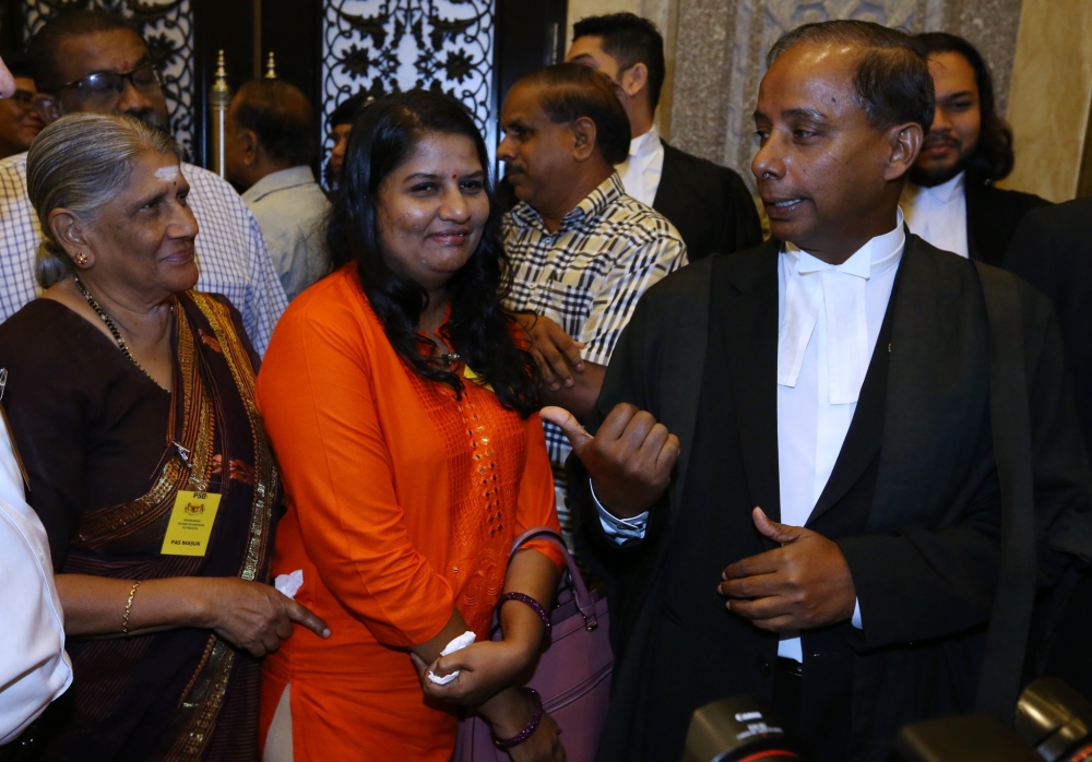 Indira is seen here with her mother (left), and her then lawyer M. Kulasegaran (right) after winning a case at the Federal Court on January 29, 2018. — Picture by Zuraneeza Zulkifli