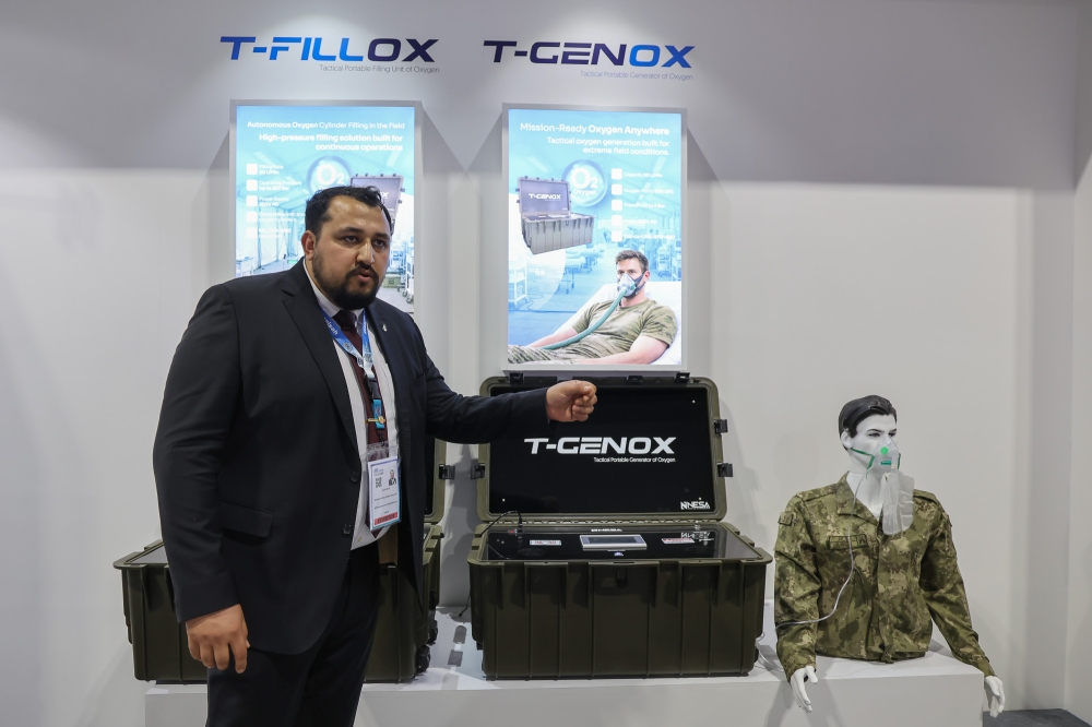Nesa Havacilik business development specialist Salih Selek presents tactical oxygen generators developed after a devastating earthquake struck Turkiye in 2023. — Picture by Yusof Isa