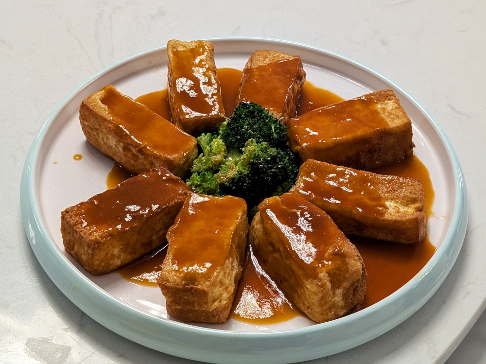 It may look ordinary, but the braised tofu in abalone sauce is much more than meets the eye. — Picture by Ethan Lau 