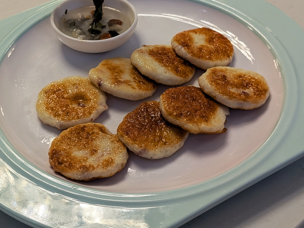 These pan-fried, hand-beaten cuttlefish cakes were sweet and springy. — Picture by Ethan Lau 