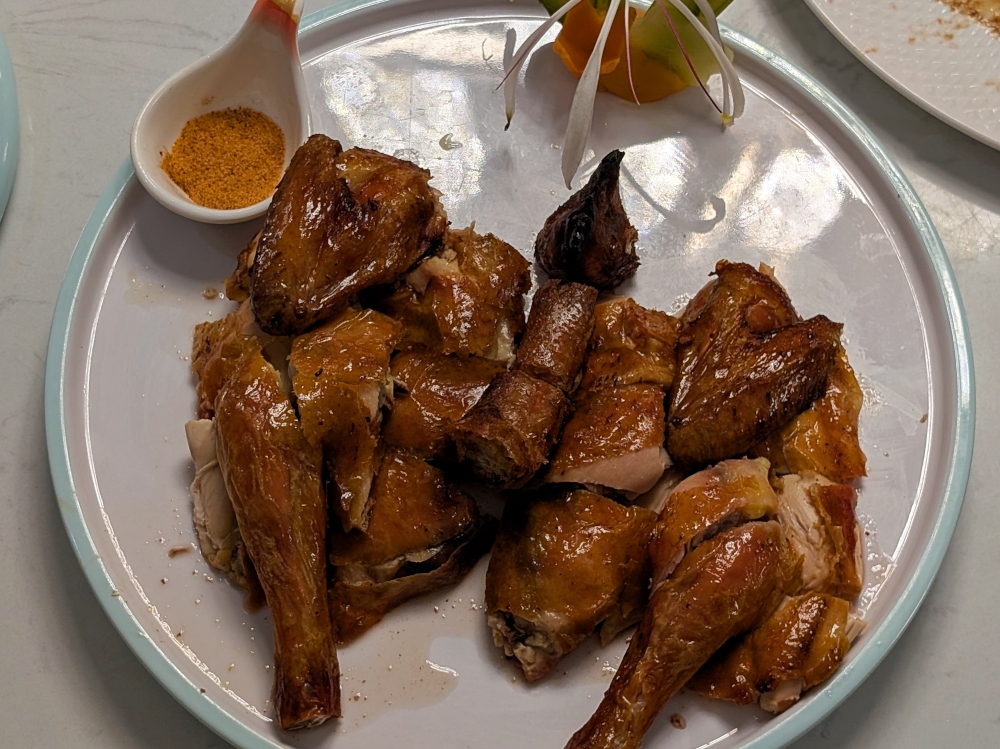 ‘Bawang’ roast chicken is another signature at Restoran Sfeng. — Picture by Ethan Lau 