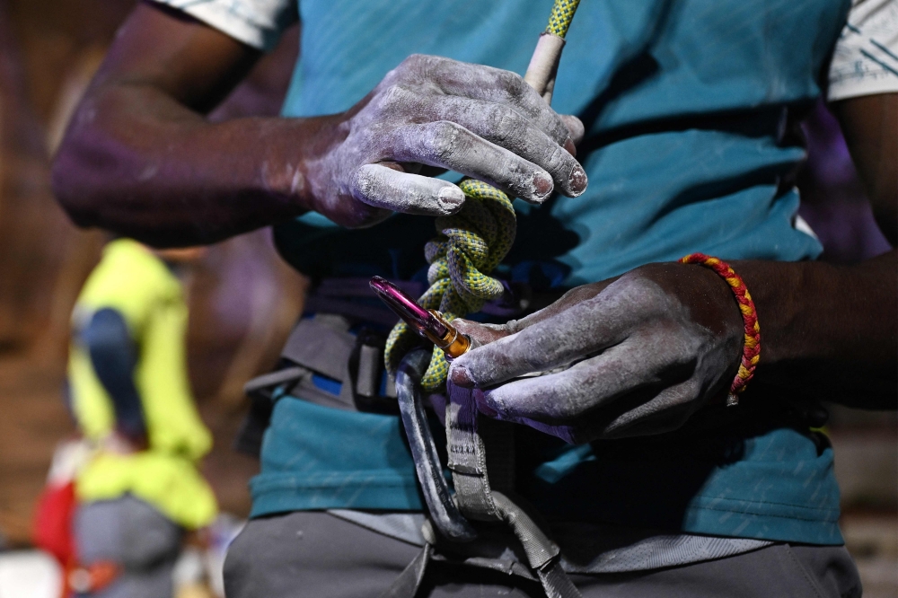 This photograph taken on March 29, 2026 shows powder-laden hands of a climber during a rock-climbing festival at a sandstone cliffs site in Karnataka’s Badami town. — AFP pic
