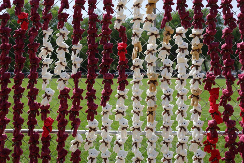 Teddy bears are seen attached to a fence as part of an installation organised by Razom for Ukraine on the National Mall in Washington April 23, 2026. — AFP pic