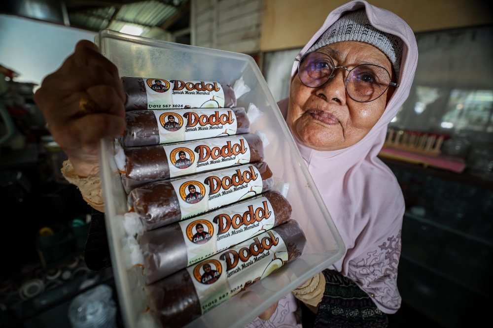 Dodol maker Chik Ah shows dodol orders prepared for customers at her home in Kampung Jasa, Chemor. — Bernama pic
