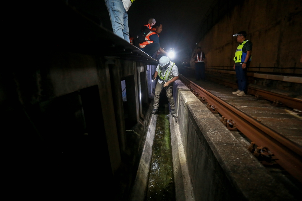 The walkway beside the tracks offers a potential hiding spot for would-be cable thieves, where sniffer dogs are specially trained to detect concealed cutting tools and unauthorised individuals within. — Picture by Sayuti Zainudin