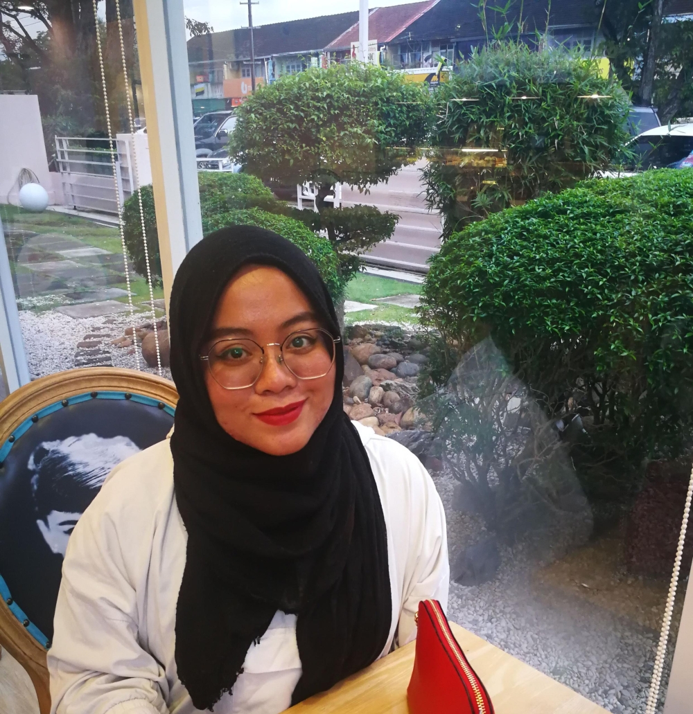 Ili Aqilah, 37, a senior communications officer, plans her trip to Ipoh and outstation carefully after the revised BUDI95 subsidy to 200 litres per month. — Picture by John Bunyan