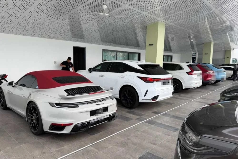 Some of the luxury vehicles seized by the Selangor Malaysian Anti-Corruption Commission (MACC) after a raid on an NGO are seen in this photo supplied by police. — PDRM pic