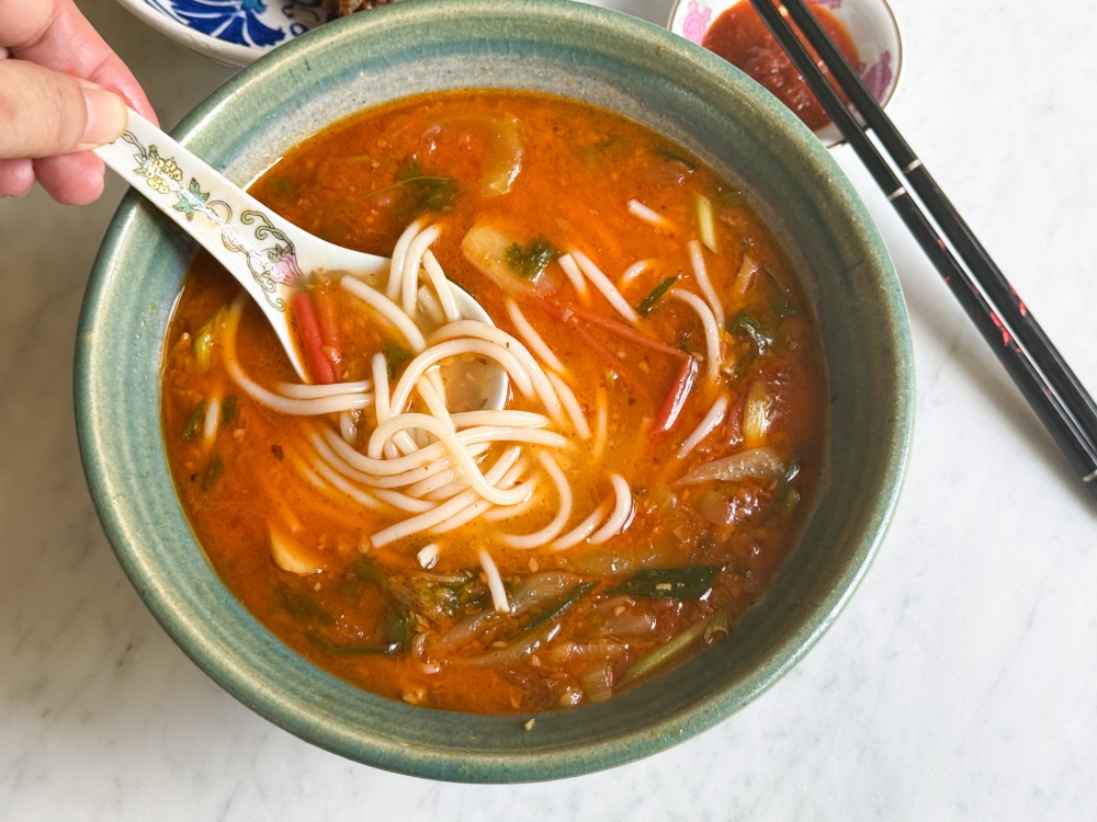 Spicy Four Finger Threadfin with thick rice noodles has a mellow heat. — Picture by Lee Khang Yi