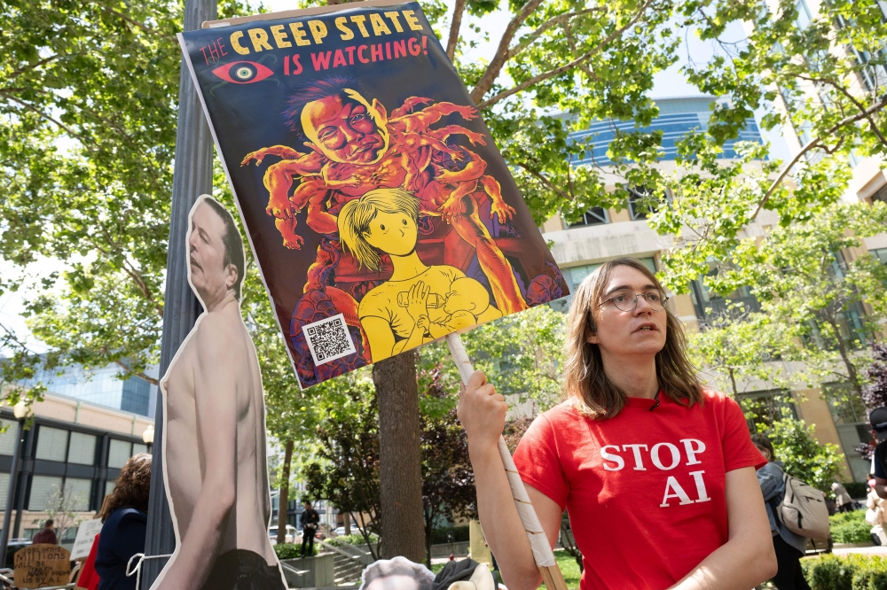 A protester with Stop AI stands outside the Ronald V. Dellums Federal Building and US Courthouse as the Musk v. Altman trial begins in Oakland on April 27, 2026. — AFP pic