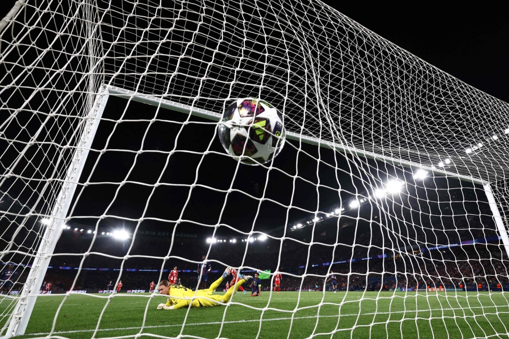 Bayern Munich forward Luis Diaz shoots and scores his team’s fourth goal against Paris Saint-Germain goalkeeper Matvey Safonov during the UEFA Champions League semi-final first leg match at the Parc des Princes in Paris on April 28, 2026. — AFP pic