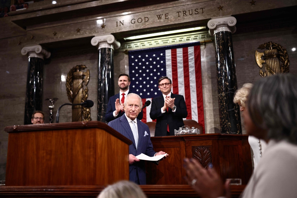US Vice President JD Vance and House Speaker Mike Johnson applaud after Britain’s King Charles III arrives to address a Joint Meeting of Congress in the House Chamber at the US Capitol in Washington on April 28, 2026. — AFP pic