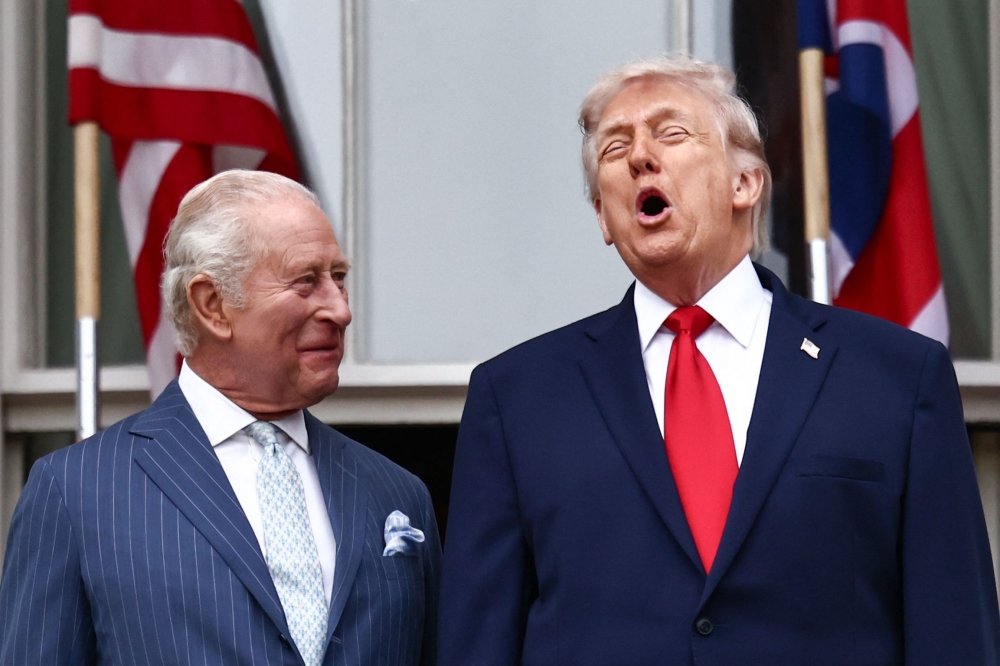US President Donald Trump and Britain’s King Charles III speak on the Blue Room balcony during an arrival ceremony at the White House in Washington on April 28, 2026. — AFP pic