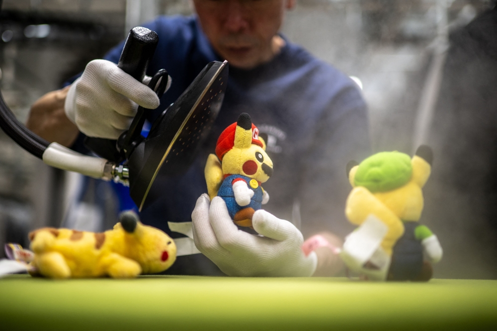 A worn-out Pikachu plushie, tired teddy bear or stained stuffed animal can all get a new lease on life at a Japanese laundry service making beloved toys squeaky clean again. — AFP pic 