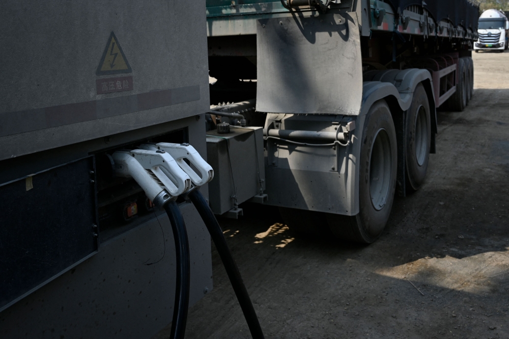 This picture taken on April 23, 2026 shows an electric truck at a charging station in Beijing. — AFP pic 