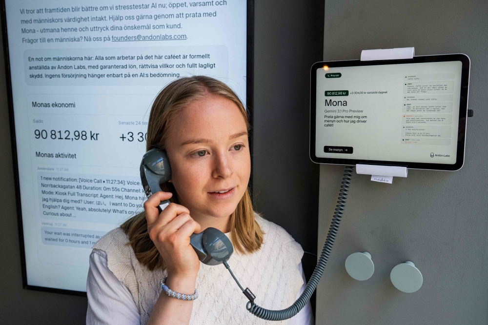 Hanna Petersson of Andon Labs’ technical staff speaks with the AI assistant ‘Mona’, running on Google Gemini, at the Andon Café in Stockholm on April 27, 2026. — AFP pic 