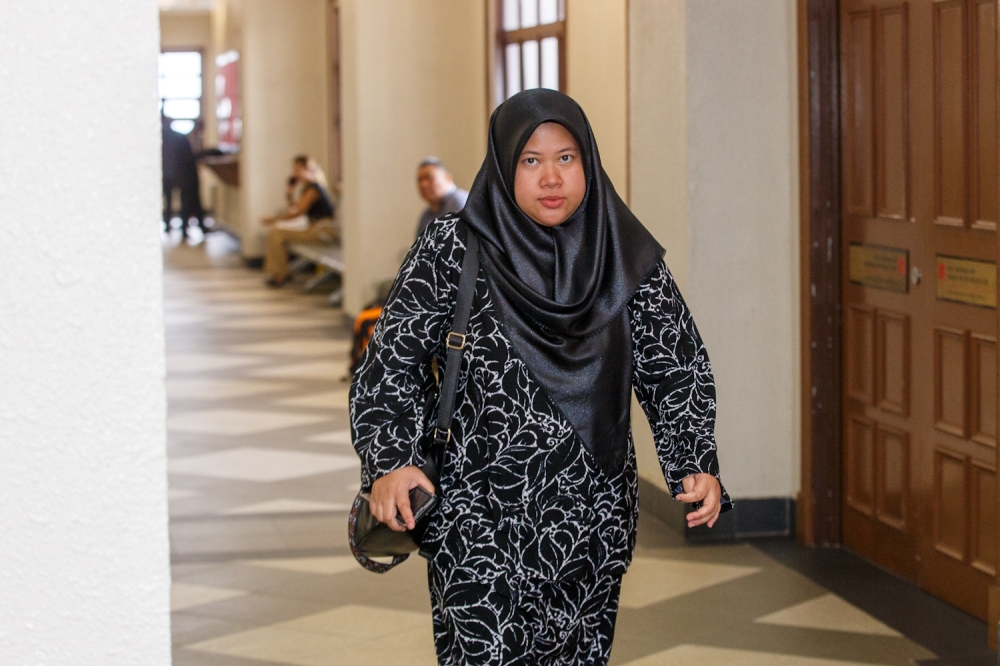 Bank Muamalat PKNS Shah Alam assistant branch manager Norazeanti Miswan, the ninth prosecution witness, is seen leaving the courtroom at the Kuala Lumpur Court Complex following proceedings for the corruption trial April 29, 2026. — Picture by Raymond Manuel