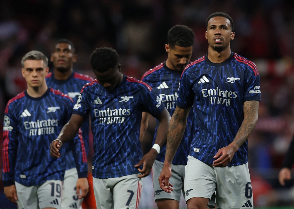 Arsenal’s Bukayo Saka and Gabriel Magalhaes walk with teammates after the match at Riyadh Air Metropolitano on April 29, 2026. — Reuters pic