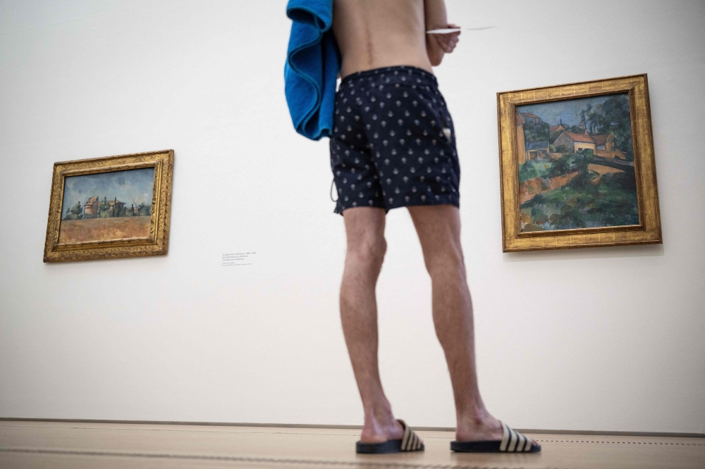 ‘Absurd but fun’: Visitors don swimsuits for free entry to Swiss museum’s 19th-century Cezanne exhibition