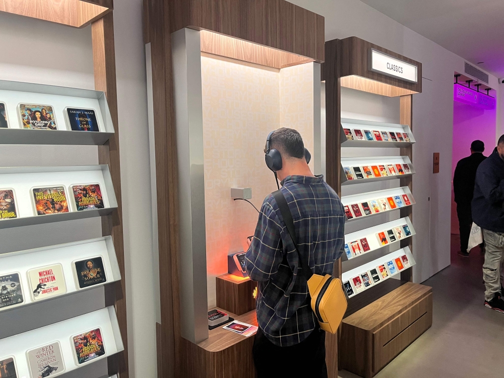 Audible’s ‘bookless bookstore’ in New York lets visitors browse audiobook ‘story tiles’ and listen to excerpts through headphones. — AFP pic