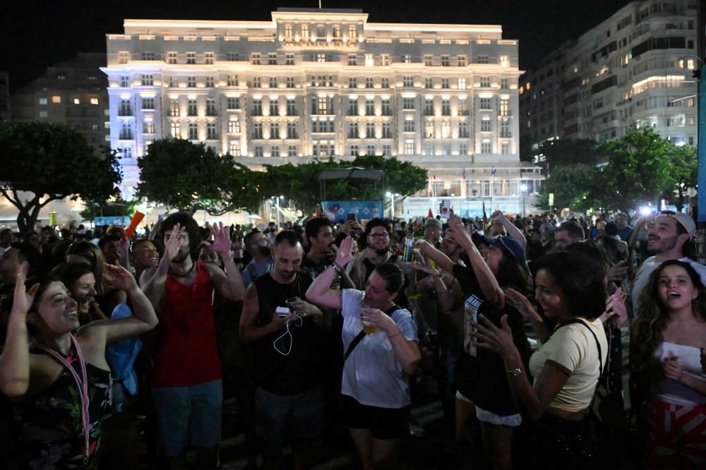 People dance during a rehearsal by Colombian singer Shakira in front of the Copacabana Palace hotel at Copacabana Beach in Rio de Janeiro May 1, 2026. — AFP pic
